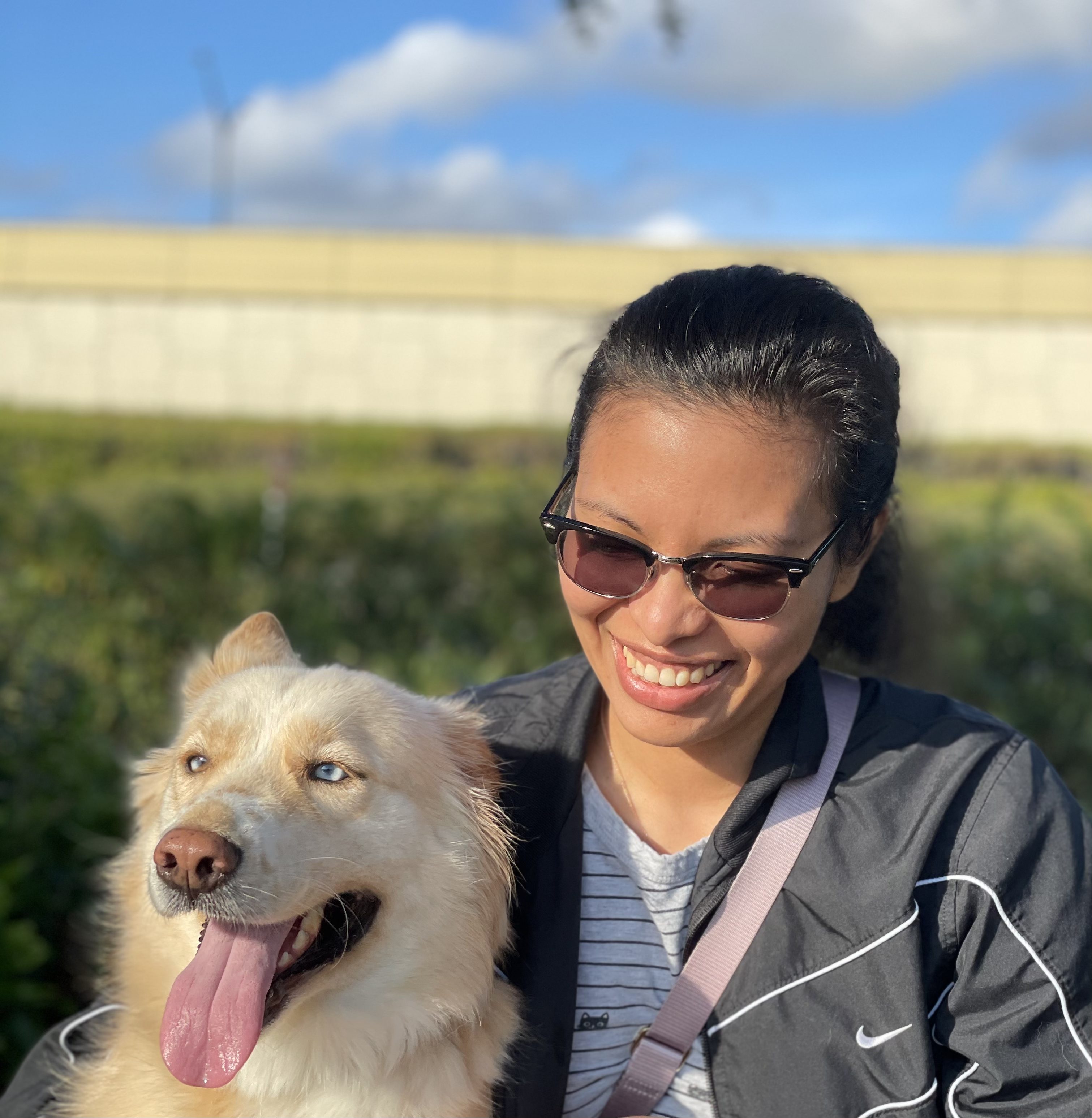 Image of the author with a white/tan siberian husky mix